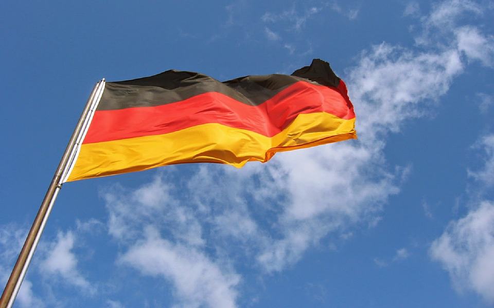 germany-flag-flying-german-breeze-flag-pole-waving-1398668